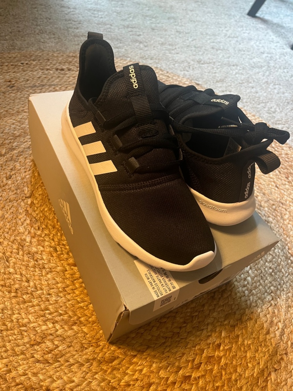 adidas Women’s Black Sneakers with White Stripes